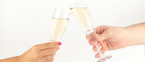 man and woman hands with champagne glass
