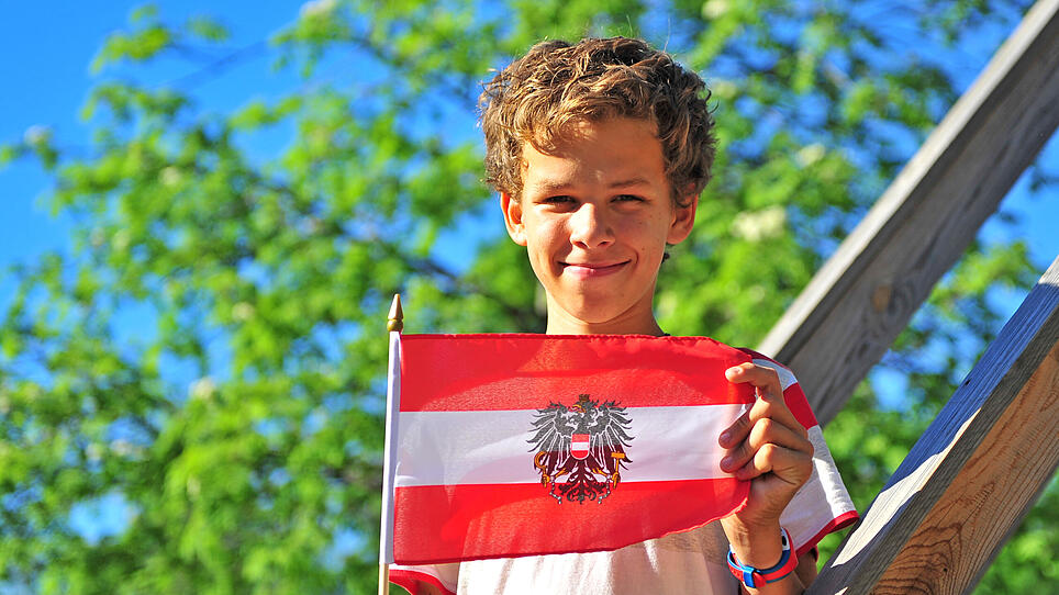 Happy teenager with a flag of Austria